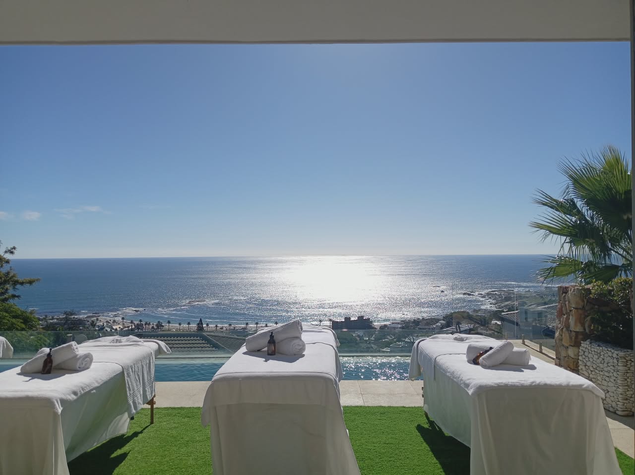 Hiking trails scenic setup with three massage beds overlooking panoramic Atlantic ocean