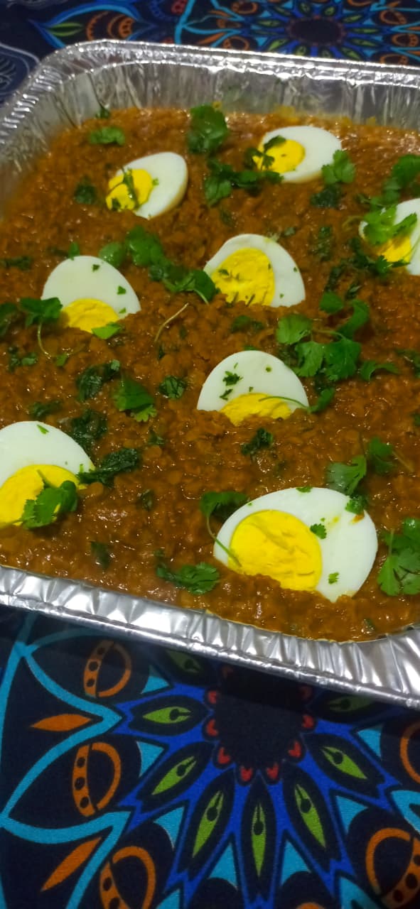 Bobotie topped with boiled egg