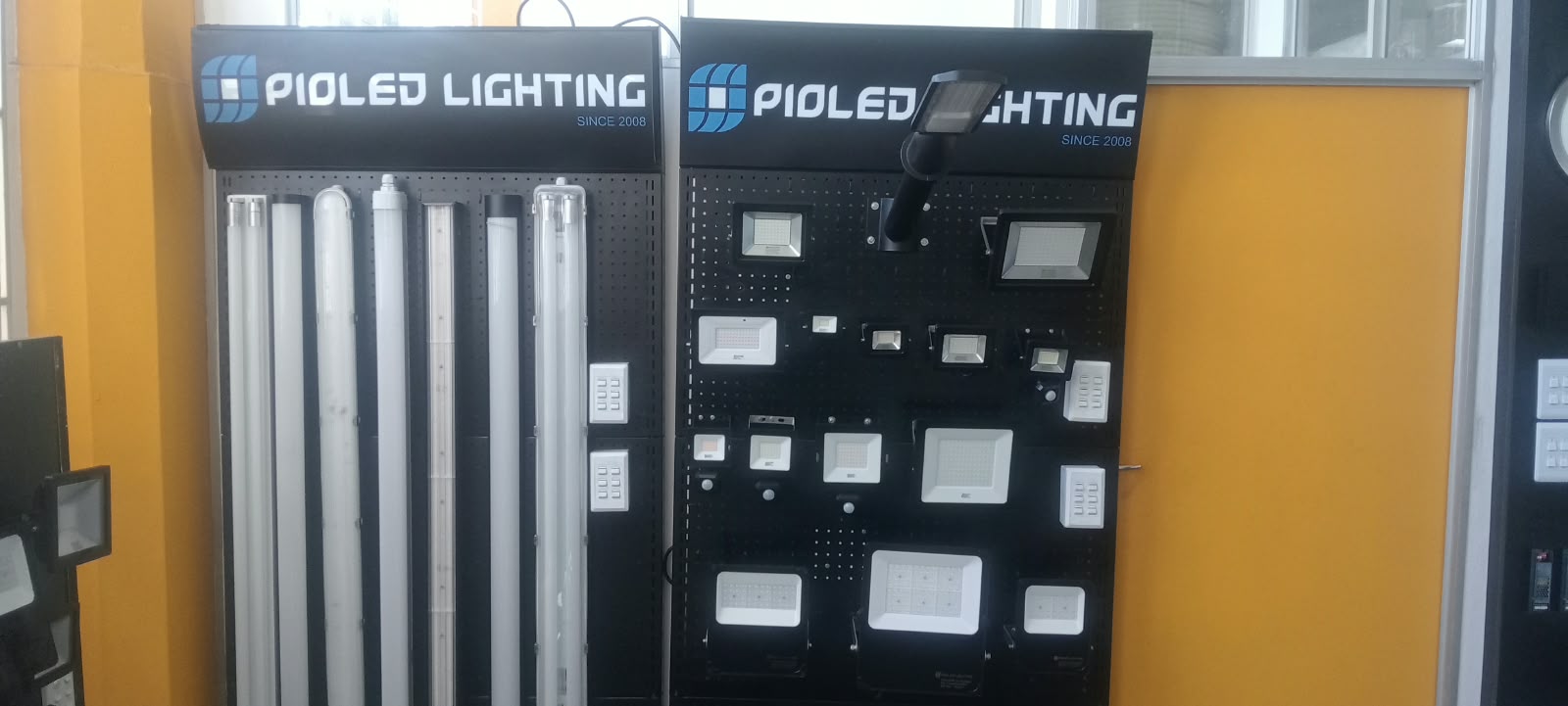 Pioled Lighting display stands with LED tubes and floodlights in the showroom
