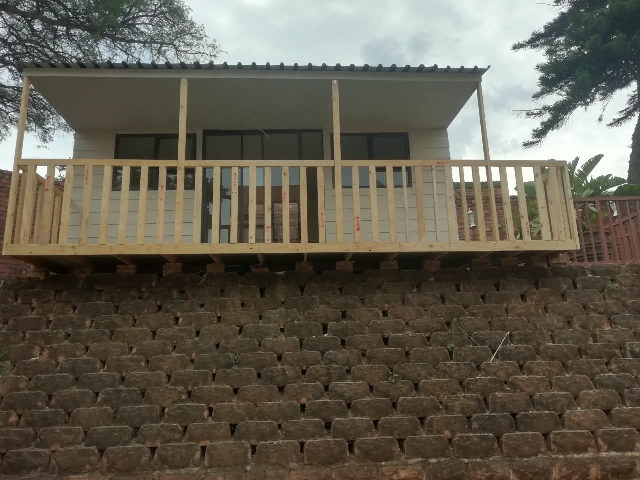 Timber deck with a roof built over a terrace