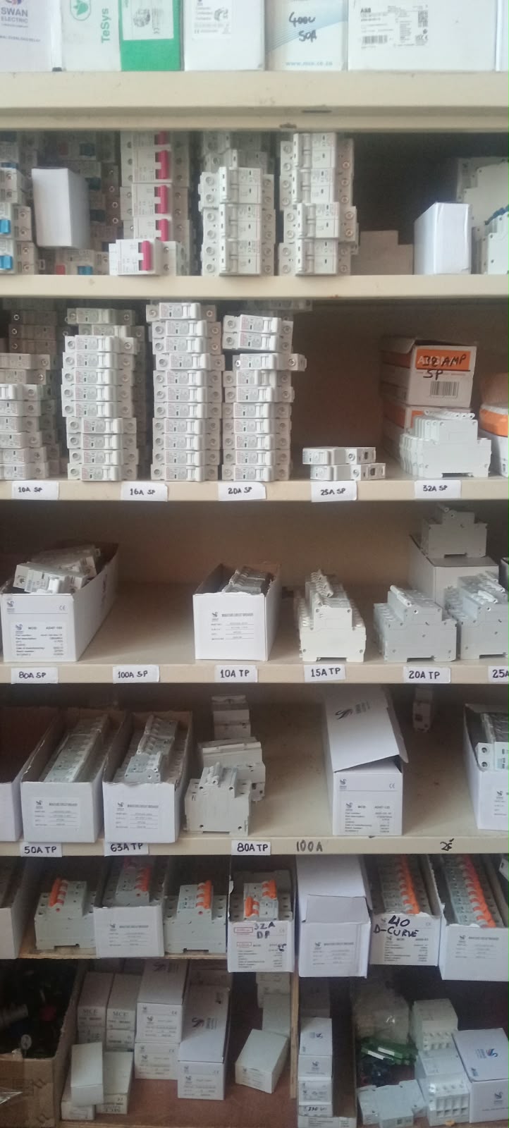 Shelves of labelled circuit breakers sorted by amp rating